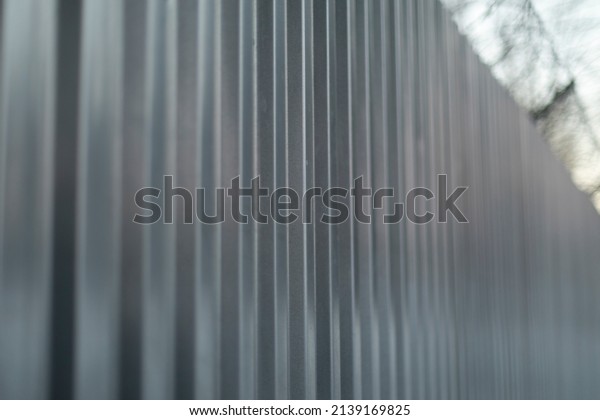 Steel fence. Stainless steel. Fence of territory.
Profile sheet.