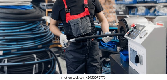 Steel fittings for hydraulic hoses, Industrial worker in warehouse in manufacturing factory, banner. - Powered by Shutterstock