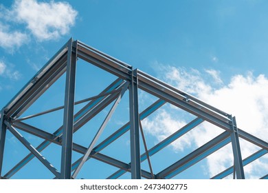 Steel Frame Construction Under Blue Sky - Powered by Shutterstock