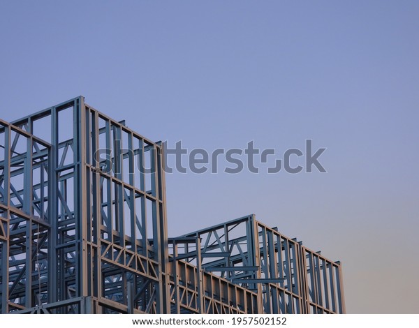 Steel Frame Town House - House Construction\
with a Blue Sky\
background