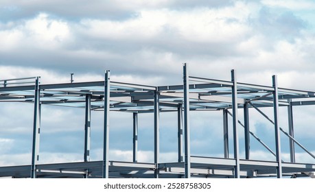 Steel framework rises against a dramatic sky at a construction site, showcasing modern architecture in progress - Powered by Shutterstock