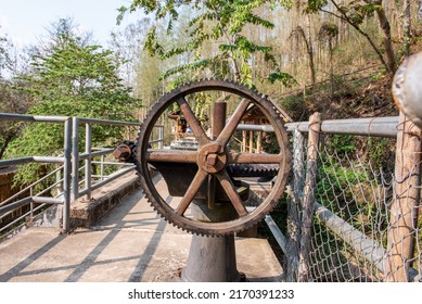 Steel gears on the floodgate used for control the flow of water. Metal mechanical gear on the floodgate for open or close the dam gate.