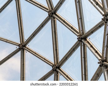 Steel And Glass Facade In A Creative Design. Architecture Of An Architectural Dome. Building Interior With A Detail Of The Construction. Close-up Of The Structure Of A Concept.