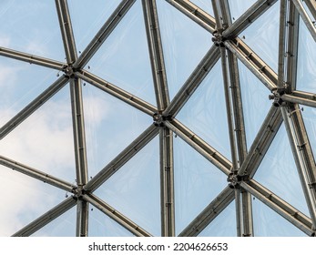 Steel And Glass Facade In A Creative Design. Architecture Of An Architectural Dome. Building Interior With A Detail Of The Construction. Close-up Of The Structure Of A Concept.