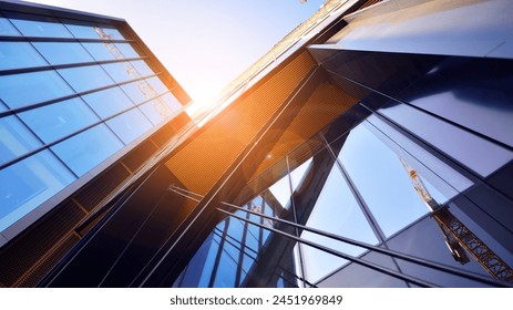 Steel and glass. The subject of modern architecture or construction industry. Modern office building facade with tall steel construction elements and full height windows between. - Powered by Shutterstock