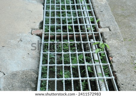 Steel grate drain cover or trench cover is made of metal. Selected focus.