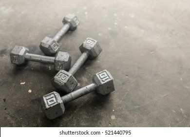 Steel Gray Weights On Gym Floor