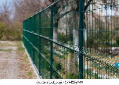 Steel Grill. Green Fence With Wire. Fencing.