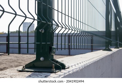 Steel Lattice Green Fence With Wire. Fencing. Grid Industrial Wire Fence Panels, Pvc Metal. Installation Of Sectional Fencing. Welded Mesh Fence. Installation Of A Grid For Fencing The Territory