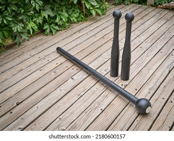 Steel Mace And Clubs On A Backyard Deck, Functional Fitness Concept