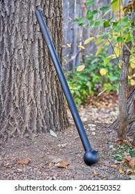 Steel Mace (or Macebell) On A A Backyard, Fitness Concept Using Unconventional Equipment