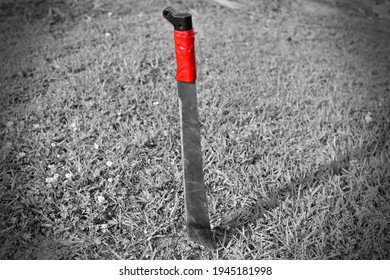 Steel Machete Blade In The Ground