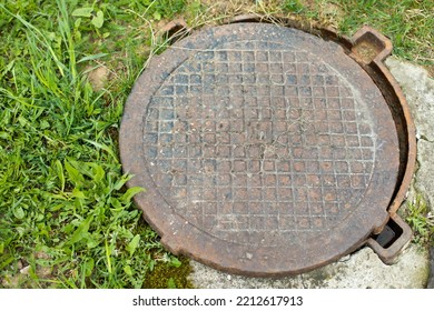 Steel Manhole Cover. Sewerage In City. Hatch In Ground.