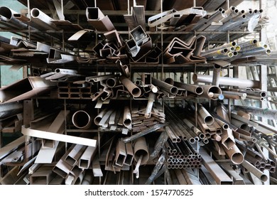 Steel materials, Aluminum metal sheet waste after machining , stainless steel rubbish , scrap metal pile junk yard waste, stacked together Prepare for recycle or reused. Environment concept