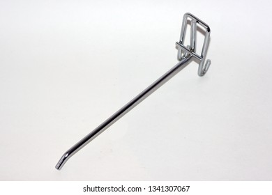 Steel Metal Coat Hook Close Up On A Light Background. Hooks For Clothes