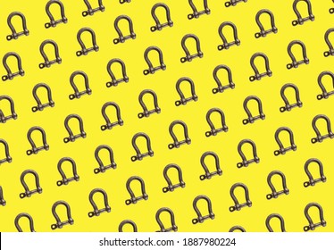 Steel Metal Rigging Shackle Pattern On Yellow Background. 