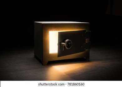 Steel money bank safe on a dark background / dramatic lit image