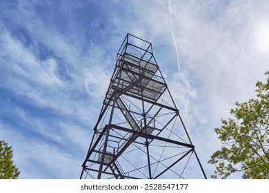 Steel observation tower in a forest.        - Powered by Shutterstock