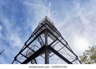 Steel observation tower in a forest.        - Powered by Shutterstock