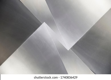 Steel panels or sheets. Abstract modern architecture exterior or interior detail. Industrial background in hi-tech style. Polygonal geometric structure in shades of metallic gray color. - Powered by Shutterstock