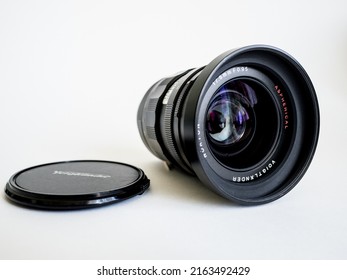 Steel Photo Lens On A White Cyclorama