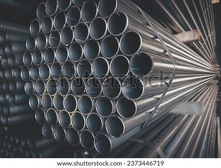 Steel pipes are placed in factory, steel pipe for fabrication,Stacked together of steel tube, close-up.steel pipes in  in warehouses awaiting delivery.at thailand