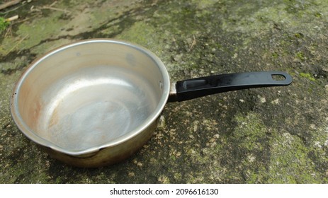 Steel Pot And Cooking Pan Top View. Empty Open Metal Saucepan With Plastic Handles. Stainless Casserole Dish Isolated On White Background. Kitchen Utensil, Iron Cookware