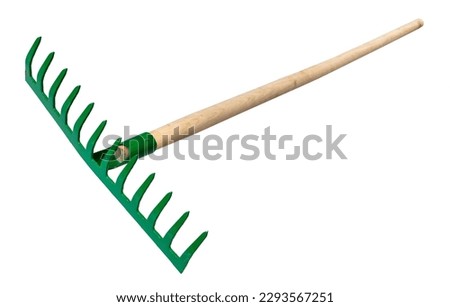 steel rake with tines pointing up with wooden handle isolated on white background