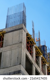 Steel Reinforcement Structure Of Rebars For Concrete Pouring At Construction Site. Housing Construction, Monolithic Concrete Frame Of Apartment Block Building Under Construction 