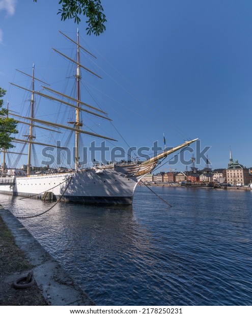 The steel sailing ship af Chapman and the old\
Indian Man Götheborg, at the old town Gamla Stan, for the East\
India voyage arriving to Shanghai 2023, a sunny summer day,\
Stockholm Sweden 2022-07-13