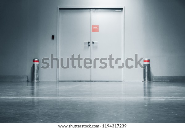 Steel Security Door and fire Protection System\
in Department Store, Entrance Gate Doorway and Guard Post of\
Storehouse Workshop. Architecture of Steel Doors and Corridor\
Flooring in Factory\
Warehouse.