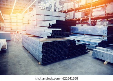 Steel, Shelf With Structural Materials On The Shelves In The Building Warehouse. High Contrast And Monochrome Color Tone. 