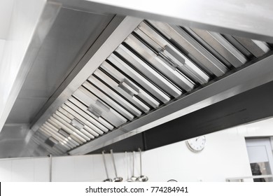 Steel shiny clean cooker hood in a restaurant
