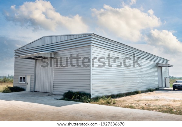 Steel\
Shutter Roller Door of Factory Warehouse Workshop for Materials\
Storage, Front View of Rolling Metal Doors for Access and Security.\
Gate Building Structure of Warehouses for\
Store