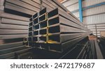 Steel square pipe and flat pipe in the factory Steel pipes for production Stacking of steel pipes Steel pipes in warehouse waiting for delivery Metal pipes in the factory