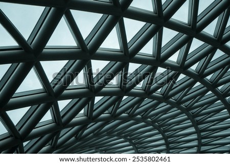 Steel structure designed to be a molecule. Truss structures of roof. Glass windows grid .Beautiful geometric shapes of clear glass roof can see through the sky.