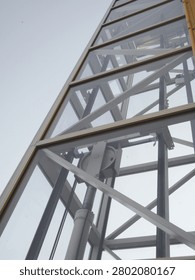Steel structure of an elevator shaft mounted on the exterior wall of the building