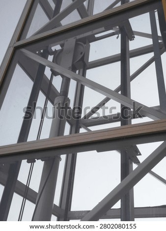 Steel structure of an elevator shaft mounted on the exterior wall of the building