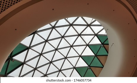 Steel Structure Roof Ceiling Made Of Metal And Glass With Blue Sky Background. Modern Sleek Shopping Architecture In Mall.