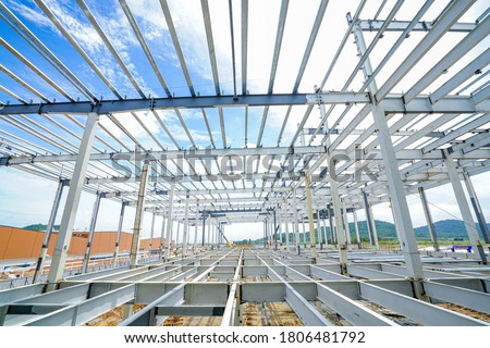 Steel structure roof truss frame and steel structure mezzanine floor under the construction building with blue sky           