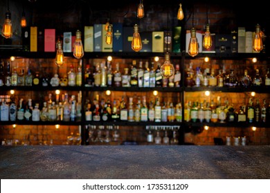 Steel Table With Soft Focus Liquor Bar Background