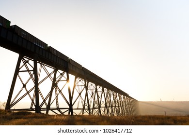 Steel train bridge stretching across a canyon
