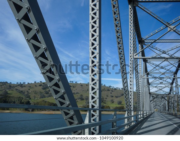 A
steel truss road bridge crossing Lake Hume with mountain view in
distance. Bethanga Bridge, the bridge crosses the border between
the Australian states of New South Wales and
Victoria