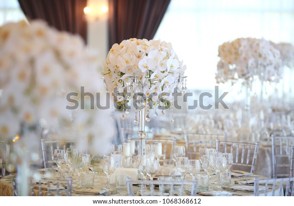 Steel Vases Orchids Stand On Dinner Stock Photo Edit Now 1068368612