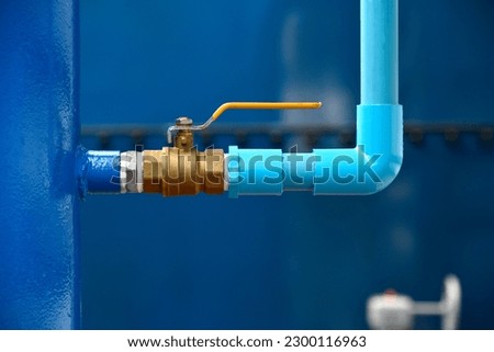 Steel water valve fitting with PVC pipe close up image. Select focus of drink water piping. Flange Pipe Fitting