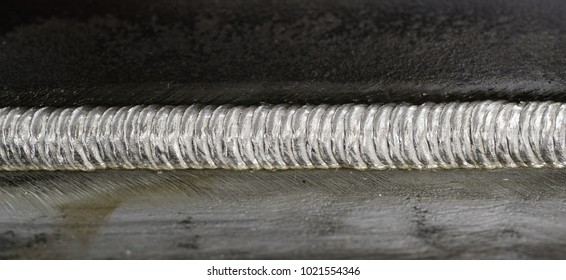 Steel weld joined by arc welding process - Shutterstock ID 1021554346