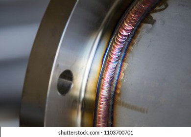 Steel weld joined pipe to plate by arc welding process . rainbow color.with copy space - Shutterstock ID 1103700701