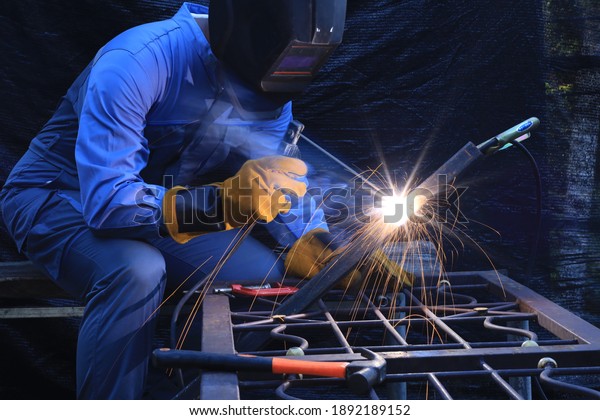 Steel welder work at\
factory