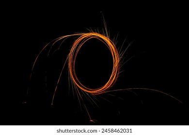 Steel wool circle drawing fireworks, steel wool spinning makes reflection on the dark backgrounds. - Powered by Shutterstock