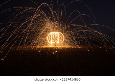 Steel wool orb light painting long exposure trails - Powered by Shutterstock